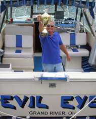 Captain Marv of Evil Eye Charters poses with first place trophy for winning 2010 NCCBA Lake Erie Walleye Fishing Tournament