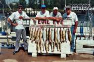 Lake Erie fishing charter group poses with a good catch for the day.