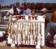 Group of kids show off their Lake Erie charter boat catch.